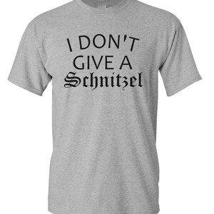May include: A gray t-shirt with the text "I don't give a Schnitzel" printed in black.