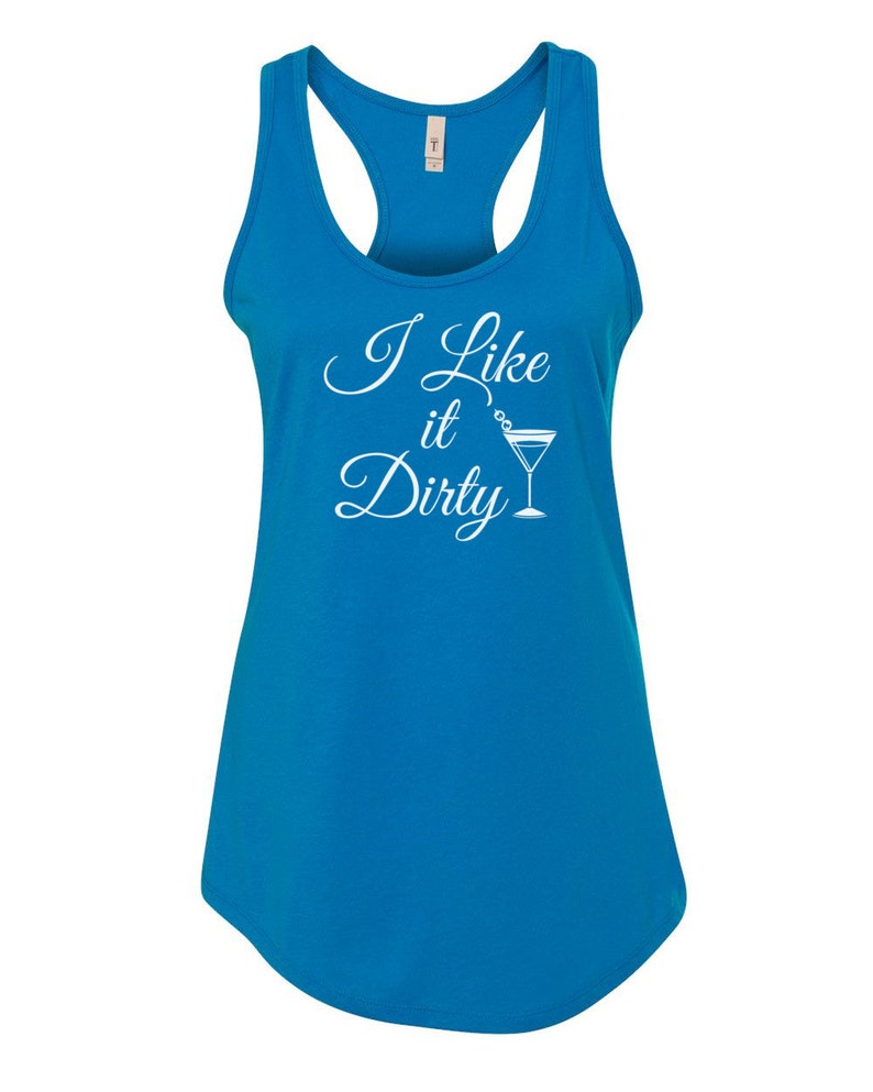 May include: A bright blue tank top with a racerback design. The front of the tank top features the white text "I Like it Dirty" with a martini glass graphic. The shirt is made of a soft material.