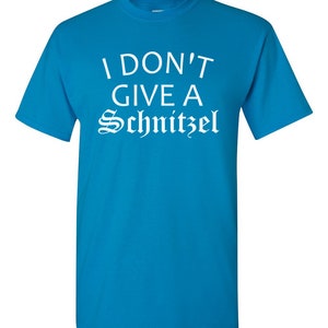 May include: A turquoise blue t-shirt with the text "I don't give a Schnitzel" in white.