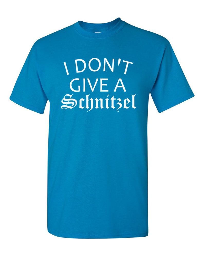 May include: A turquoise blue t-shirt with the text "I don't give a Schnitzel" in white.
