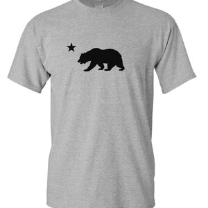 May include: A gray t-shirt with a black silhouette of a bear and a star, representing the California state flag.
