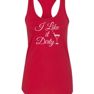 May include: A red racerback tank top with the phrase "I Like it Dirty" in white script and a martini glass graphic. The tank top has a scoop neck and a sleeveless design.