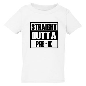 May include: White t-shirt with the text "STRAIGHT OUTTA PRE-K" in a black, bold font. The text is arranged in three lines within a black rectangular box. The shirt is a short-sleeved, crew neck style.