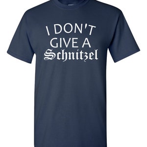 May include: A navy blue t-shirt with white text that reads "I don't give a Schnitzel".