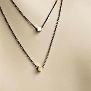 Dainty geometric black gold layered necklace set