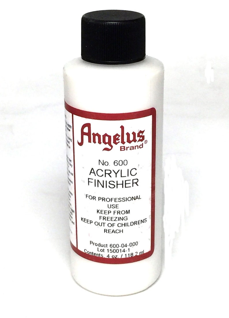 May include: A white bottle of Angelus Brand No. 600 Acrylic Finisher for professional use. The bottle has a black cap and a red label with white text. The label says "Keep from freezing. Keep out of children's reach. Product 600-04-000. Lot 150014-1. Contents: 4 oz. / 118.2 ml."