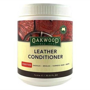 May include: A white plastic container of Oakwood Leather Conditioner. The label features the text "LEATHER CONDITIONER" and "CONDITION". The container holds 1 liter / 33.8 fl oz of product. The label also includes an image of leather goods.