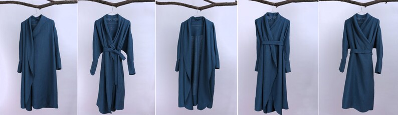 May include: Five long-sleeved, teal blue wrap dresses with a tie at the waist. The dresses are hanging on hangers against a white background.