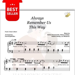 Op de afbeelding: Muziekblad voor het nummer "Always Remember Us This Way" uit "A Star is Born". Het muziekblad bevat muzieknoten, songtekst en de namen van de songwriters. Een rode "Best Seller" banner staat linksboven.