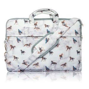 May include: A grey laptop bag with a white marble pattern and a brown and blue horse design. The bag has a shoulder strap and a top handle.