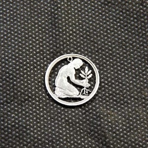 german 50 pfennig cut coin pendant.