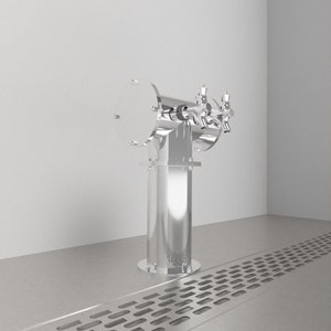 May include: A stainless steel beer tap tower with two spouts. The tower is mounted on a stainless steel base with a drain grate.