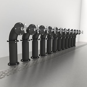 May include: A row of ten black metal beer taps with chrome spouts, mounted on a stainless steel surface with a perforated drain.