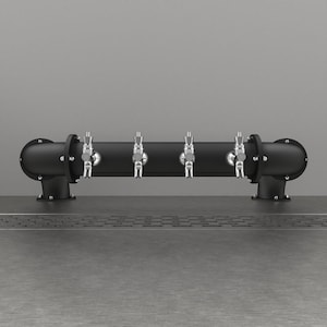 May include: A black draft beer tap system with four taps. The system has a cylindrical body with curved end pieces and silver tap handles. The tap system is mounted on a gray surface against a gray background.