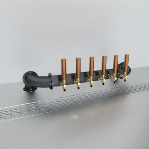 May include: A black metal beer tap system with six copper taps and a curved pipe. The taps are mounted on a black metal bar.