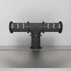 May include: A black metal T-shaped beer tap with six spouts. The tap is mounted on a stainless steel surface with a perforated drain.