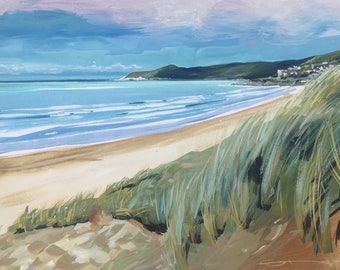 May include: A painting of a beach scene with a sandy beach, blue water, and green grass in the foreground. The beach is empty and the water is calm. There are hills in the distance.