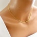 see more listings in the Gold Necklace section