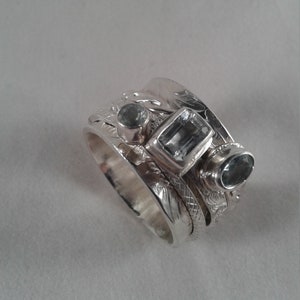 spectacular spinner, aquamarine spinner ring, three band aquamarine ring, aquamarine ring, ladies aquamarine ring, ladies ring, spinner ring