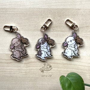 タンポポの花とロップバニーウサギのアクリルキーチェーンチャーム、グリッターエポキシコーティング付き | 説明をお読みください。
