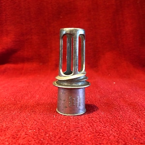 Aluminium Trademark Juistractor For straining orange, lemons, limes and grapefruit. circa 1930