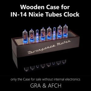 May include: A wooden case for an IN-14 Nixie Tubes Clock. The case is dark brown with a silver metal faceplate. The clock face displays the numbers 1, 8, 3, 4, 5, and 0. The text "Divergence Meter" is printed on the faceplate.