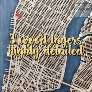 May include: A detailed wooden map of a city with three layers of wood. The map is on a blue background and has a red heart marking a location. The text "3 wood layers highly detailed" is visible in the image.