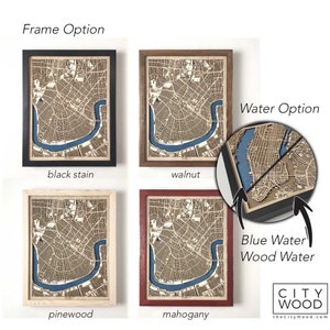 May include: Four framed wood maps with different frame colors: black stain, walnut, pinewood, and mahogany. The maps show a city with a river and are available with blue water or wood water.