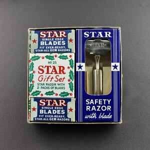 May include: A vintage Star safety razor gift set with two packs of Star single edge blades. The set includes a blue and white box with a silver safety razor and a red and white box with the text "Star Gift Set" and "Star Single Edge Blades".