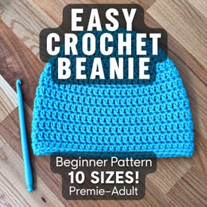 May include: A bright blue crocheted beanie with a textured stitch pattern, accompanied by a matching blue crochet hook. The image features the text EASY CROCHET BEANIE and Beginner Pattern 10 SIZES! Premie-Adult, indicating a craft project.