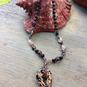 Purple and Black beaded necklace, glass charm, golden beads