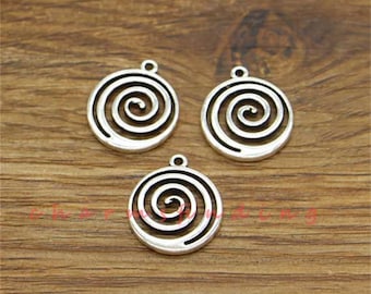 May include: Three silver-toned metal charms with a spiral design. Each charm has a loop at the top for attaching to a necklace or bracelet.