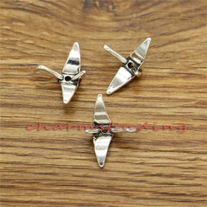 May include: Three silver origami crane charms with a hole in the center for attaching to jewelry or other crafts.