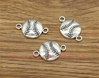 May include: Three silver-toned baseball charm pendants with jump rings. Each charm features a detailed baseball design.