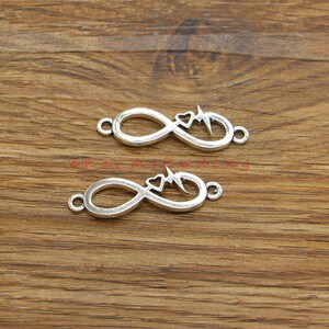 30 st. hjärtan med oändlighet, 8 länkar, berlocker, armband, halsband, antik silverfärgad, 11 x 33 mm cf4441
