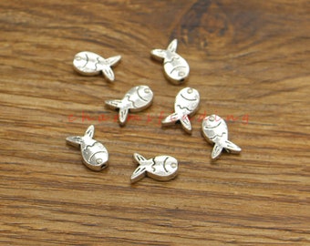 May include: Silver-toned fish-shaped metal beads. The beads have a detailed design and are perfect for jewelry making or crafting.