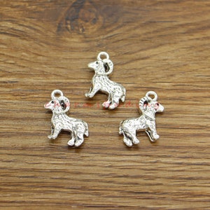 May include: Three silver-toned ram charms with a loop for attaching to jewellery or other crafts.