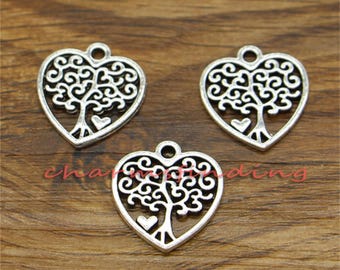 May include: Three silver heart-shaped charms with a tree of life design. Each charm features a detailed, intricate tree with swirling branches and a small heart at the base.