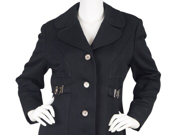 May include: A long black coat with a button closure and silver buckles at the waist.