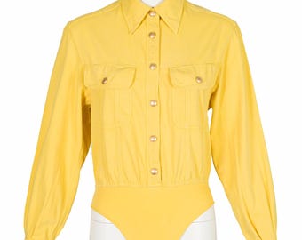 Body de algodón vaquero amarillo vintage Gucci 1993 con logo y cierre a presión, talla S