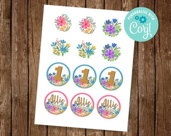May include: A set of 9 printable cupcake toppers featuring a floral design with the number 1 and the name Allie. The toppers are in shades of pink, blue, yellow, and green.
