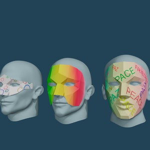 May include: Three plaster heads with different paper masks. The first mask has a colorful pattern of circles. The second mask is a rainbow gradient. The third mask has the words "Peace", "Paz", "Frieden", and "Pace" written on it.