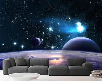 May include: A dark blue and purple space scene with a bright blue nebula and stars. A large planet is in the foreground with a smaller planet in the background. The scene is a digital illustration.