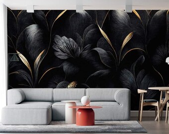 May include: A living room interior design with a gray sectional sofa, two red and white side tables, and a black and gold floral wallpaper.