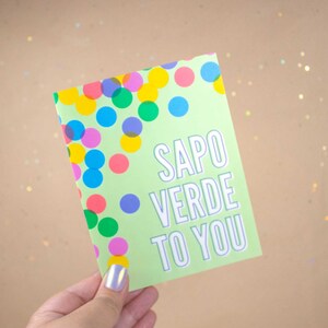May include: A green card with colorful confetti and the text "Sapo Verde To You".