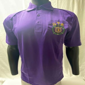 Omega Psi Phi GREEK Letters with Shield EXTREME Performance Polo