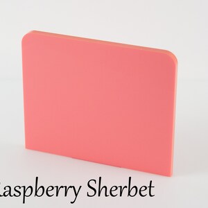 May include: A solid, rectangular piece of polymer clay in a bright, vibrant raspberry sherbet color.
