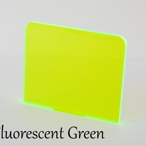 May include: A sheet of fluorescent green acrylic plastic.