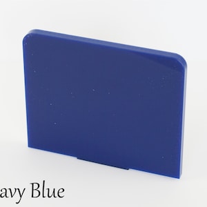 May include: A solid, rectangular piece of navy blue acrylic plastic.