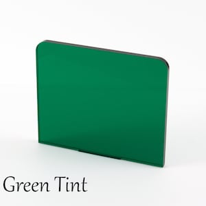 May include: A green tinted acrylic sheet with rounded corners.